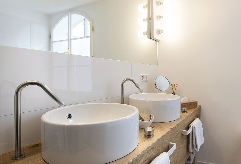 Stilvoll und individuell eingerichtetes Bad in der Roof Top Suite "Jedermann" im romantischen Hotel Salzburg